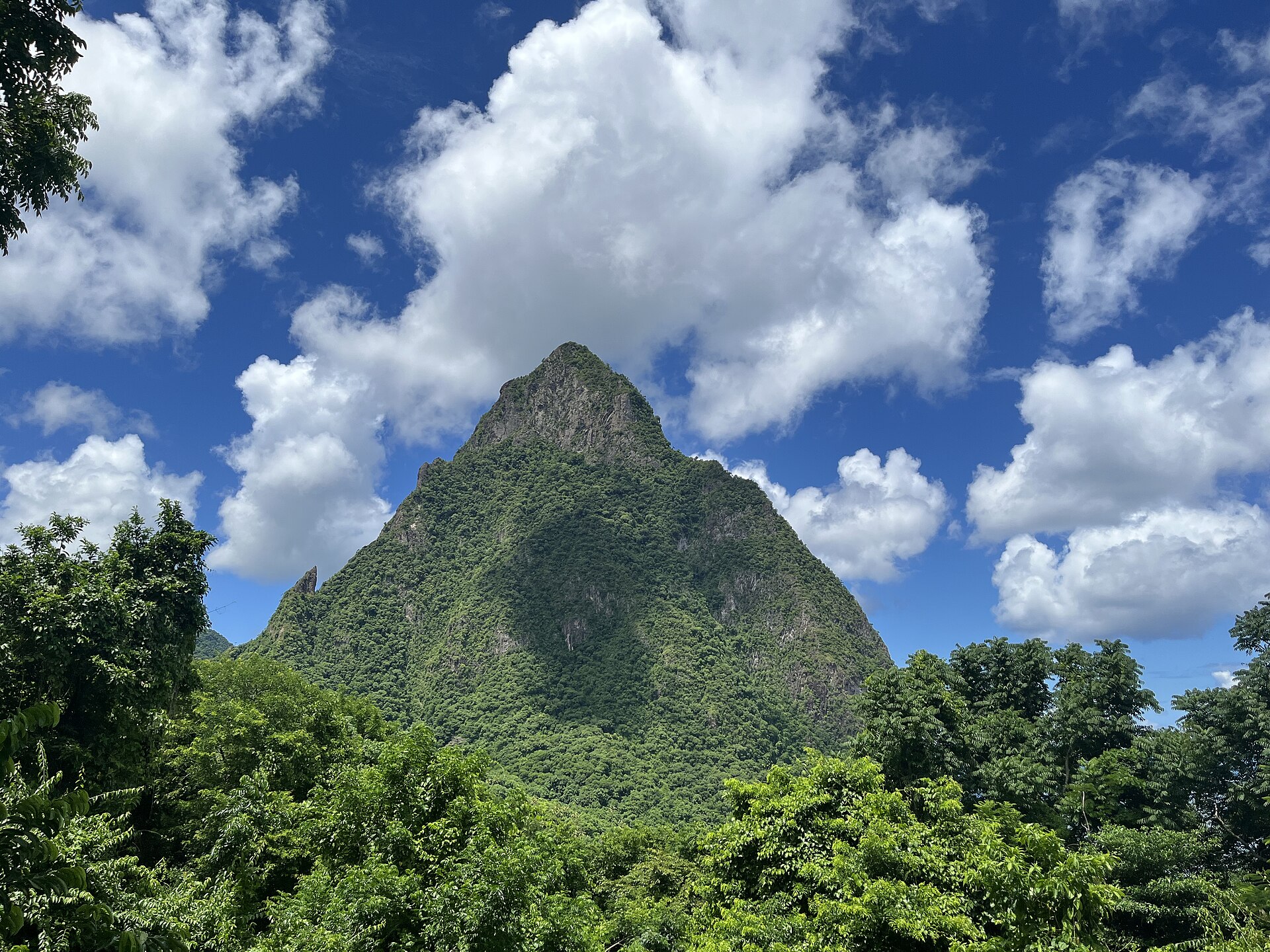 Coastal cliffs and Petit Piton above Caribbean water